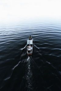 High angle view of ship sailing on lake