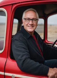 Portrait of man sitting in car