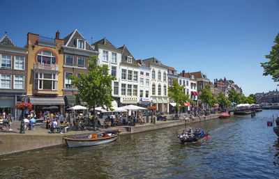 Boats in canal in city