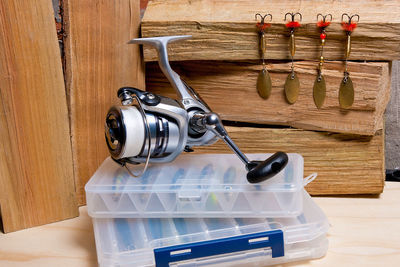 Close-up of fishing equipment on table