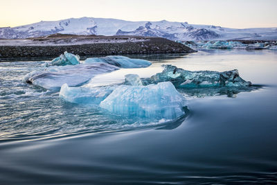 Scenic view of frozen sea against sky, jökulsarlon glacier lagoon, iceland