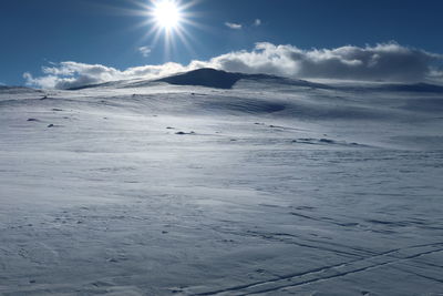 Scenic view of snowcapped mountains against sky