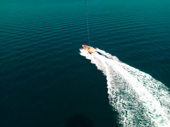 High angle view of fishing boat sailing in sea