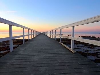 View of footbridge at sunset