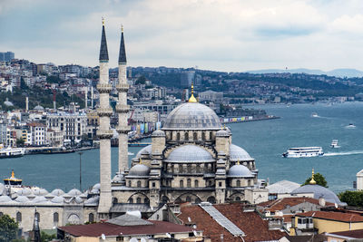 Buildings in city against sky