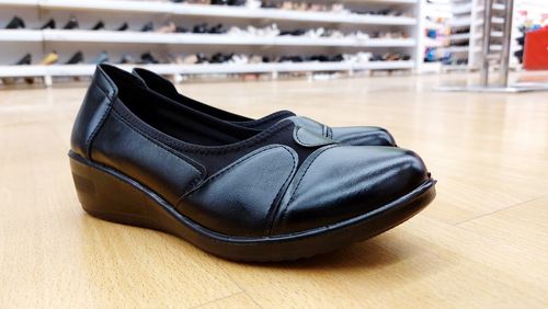 High angle view of shoes on hardwood floor