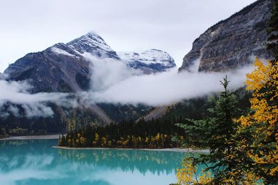 Scenic view of lake and mountains against sky