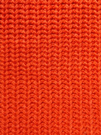 Pink knitted texture background. pattern of wool knitting for wallpaper and an abstract background.