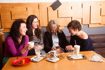 Young woman sitting at table