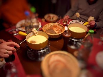 Close-up of people preparing food