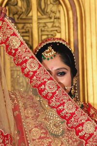 Portrait of bride wearing sari during wedding ceremony