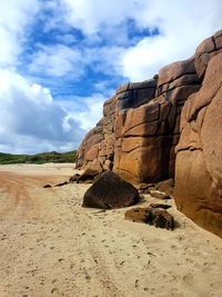 Rock formation on land against sky