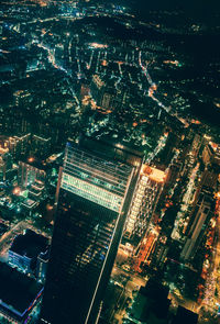 High angle view of illuminated buildings in city at night