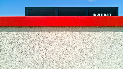 Low angle view of red wall of building