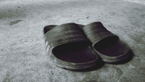 High angle view of shoes on sand