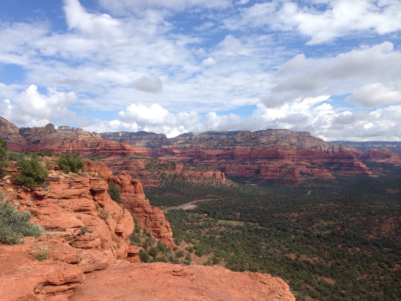 sky, landscape, tranquil scene, tranquility, scenics, rock formation, nature, beauty in nature, rock - object, cloud - sky, geology, non-urban scene, physical geography, mountain, cloud, grass, rock, remote, cloudy, arid climate