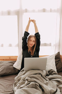 Happy business woman freelancer working chatting on the phone using technology remotely from home