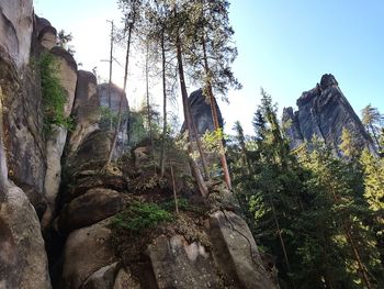 Low angle view of rock formation against sky