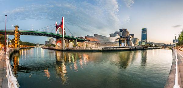 View of bridge over river in city