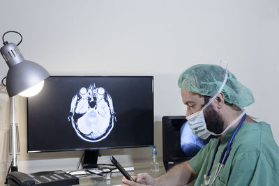 Young male doctor radiologist working in the clinic.