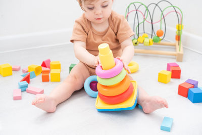 Boy playing with toy blocks