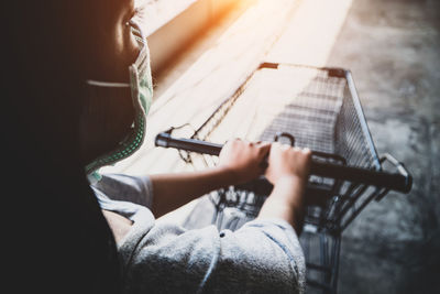 Midsection of man playing guitar