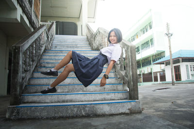 Digital composite image of schoolgirl on steps
