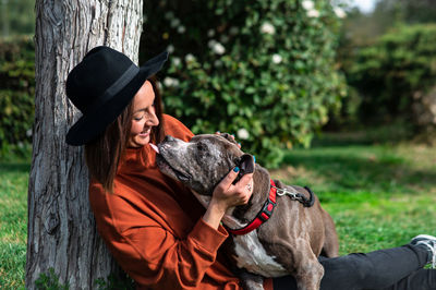 Dog playing with owner at park