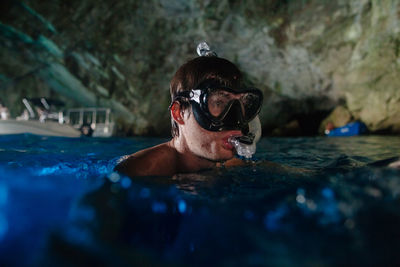 Close-up of man swimming in sea