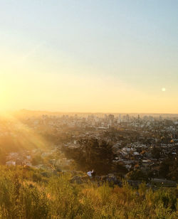 High angle view of buildings against sky during sunset