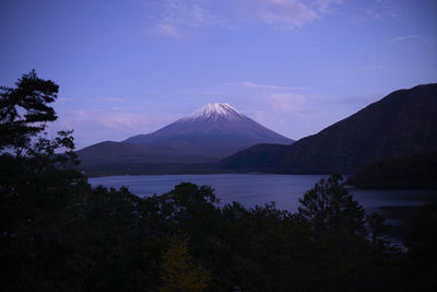 Scenic view of mountains against cloudy sky