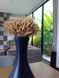 Close-up of vase on table at home