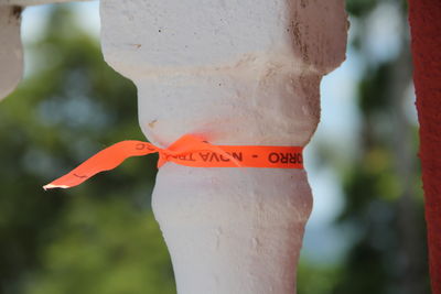 Close-up of ribbon tied on built structure