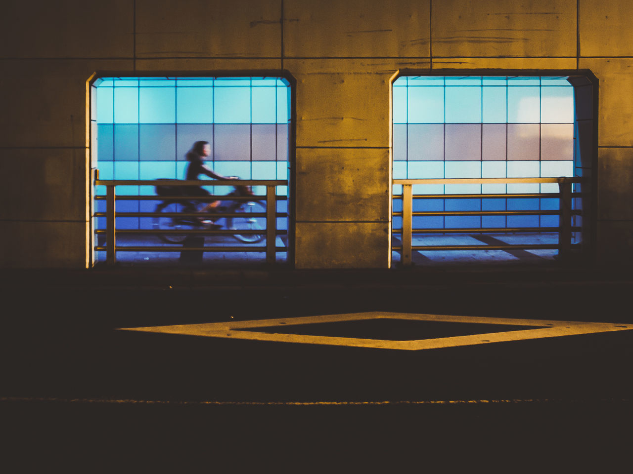 REFLECTION OF SILHOUETTE MAN IN GLASS WINDOW