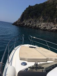 Cropped image of boat sailing in sea