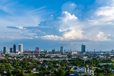 Aerial view of city buildings against sky