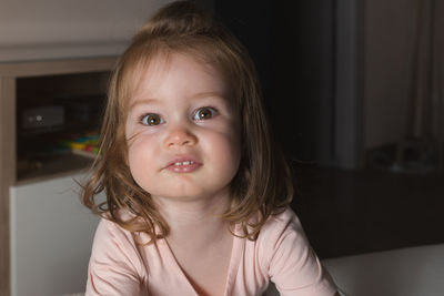 Portrait of cute girl at home