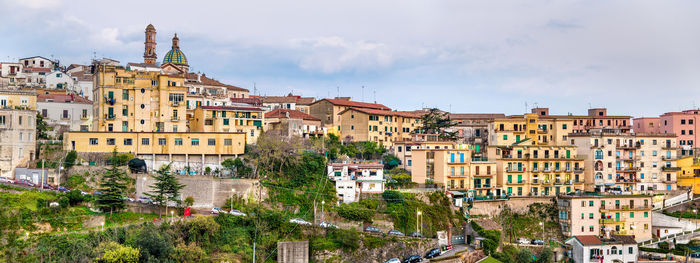 Buildings in city against sky