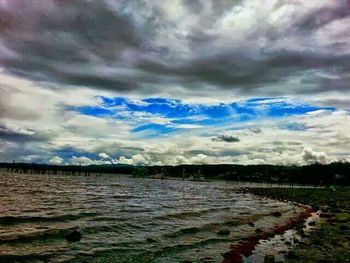 Scenic view of landscape against cloudy sky