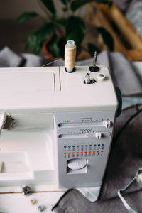 Sewing machine, accessories and fabric. cozy creative sewing process at home