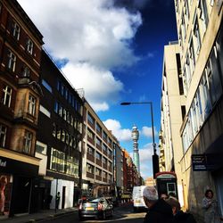 City street against cloudy sky