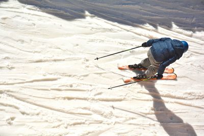 High angle view of man skiing on snow