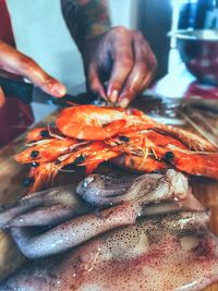 Close-up of hand holding fish