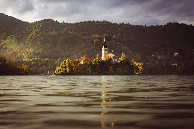 Slovenia, bled, view of bled island at autumn dusk