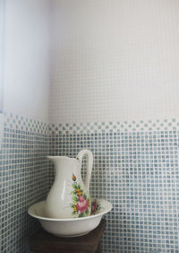 Close-up of food on table against wall at home