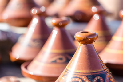 Full frame of antique brown containers for sale at market