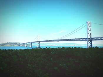 View of bridge against clear blue sky