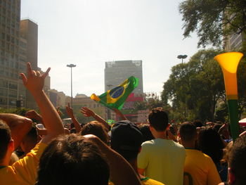 Rear view of people on street in city