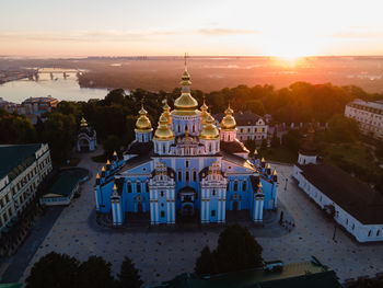 High angle view of buildings against sky at sunset