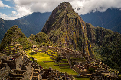 Scenic view of mountains against cloudy sky
